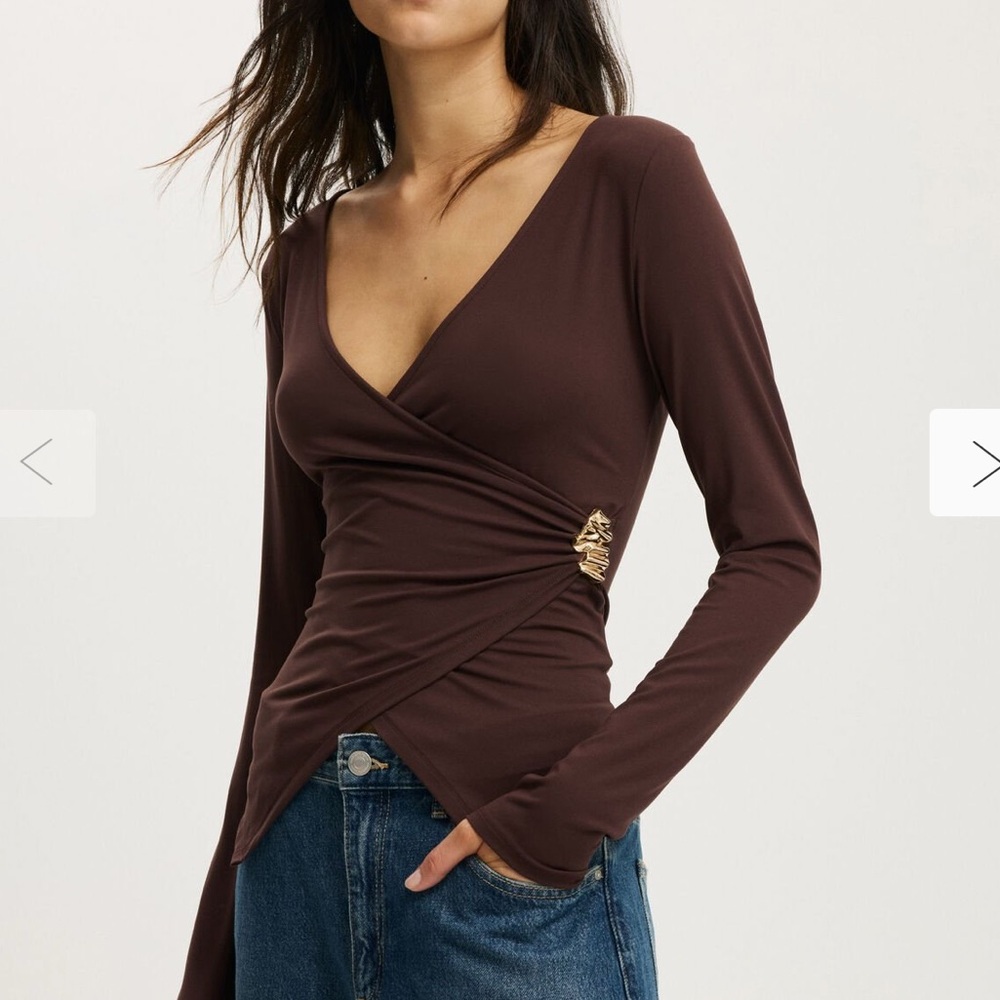 Trendy Wrap top with pendant detail